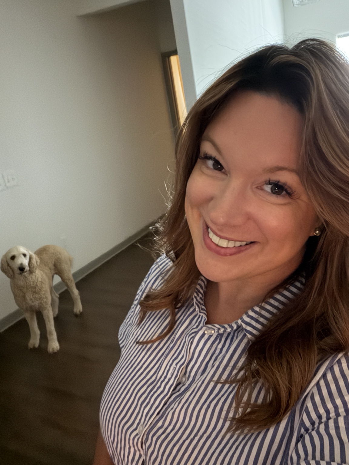 Elizabeth smiling with Cooper nearby